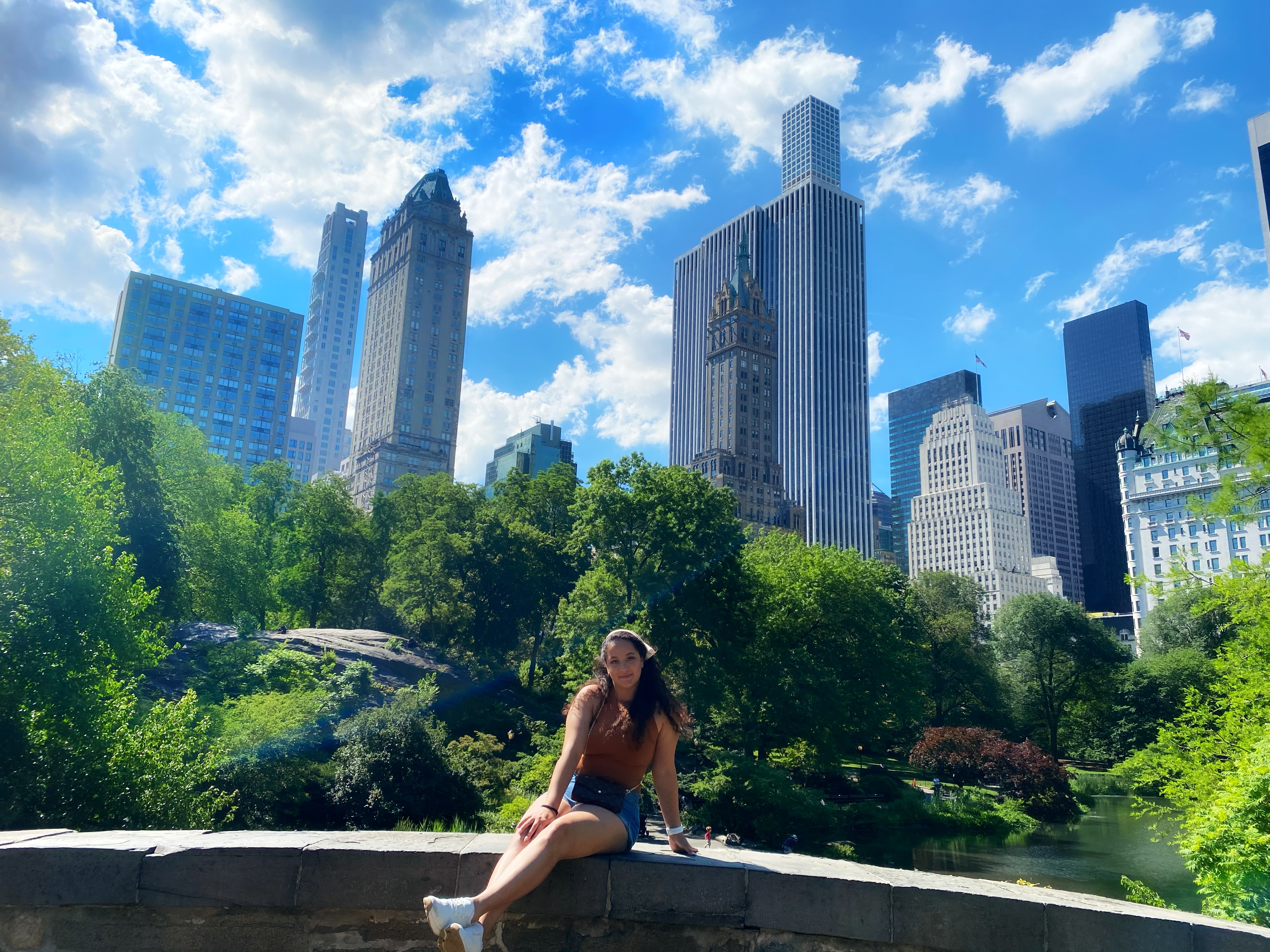 Amanda sitting on a bridge in Central Park, NY